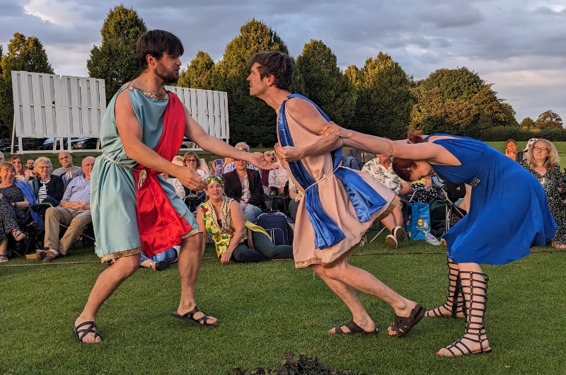 Hermia holds back Lysander from attacking Demetrius