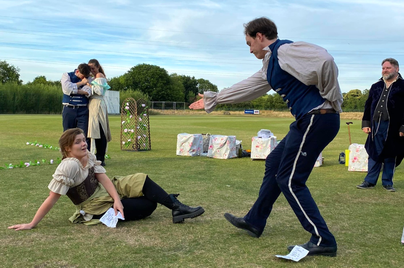 Benedick takes Beatrice's hand